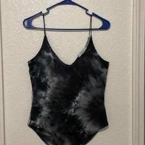 Grey and white, flexible body suit